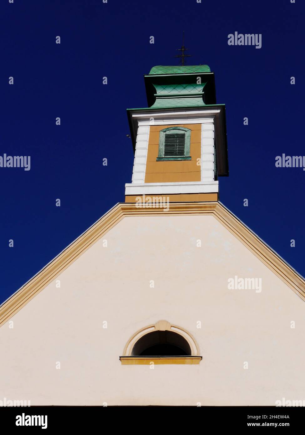 Close up of church tower against brilliant blue sky, Sibiu, Romania Stock Photo