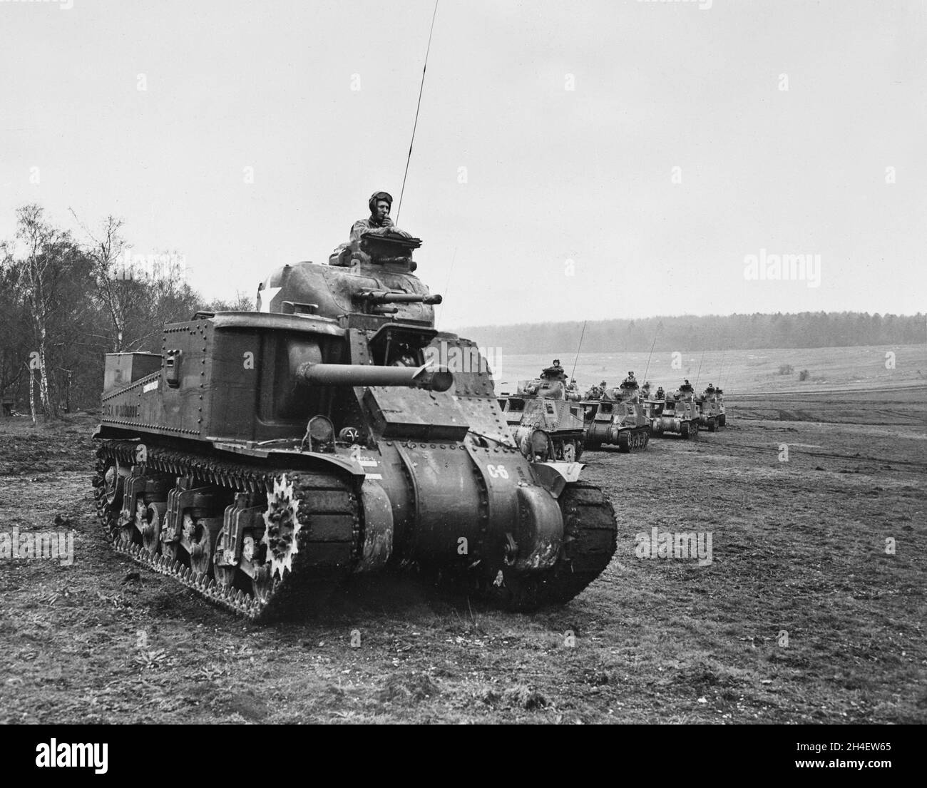 A vintage photo circa 1942 a line of American M3 General Lee or Lee medium tanks on training maneuvers in England during World War 2.  Built from August 1941 to December 1942 it served in all major theatres during WW2. Stock Photo