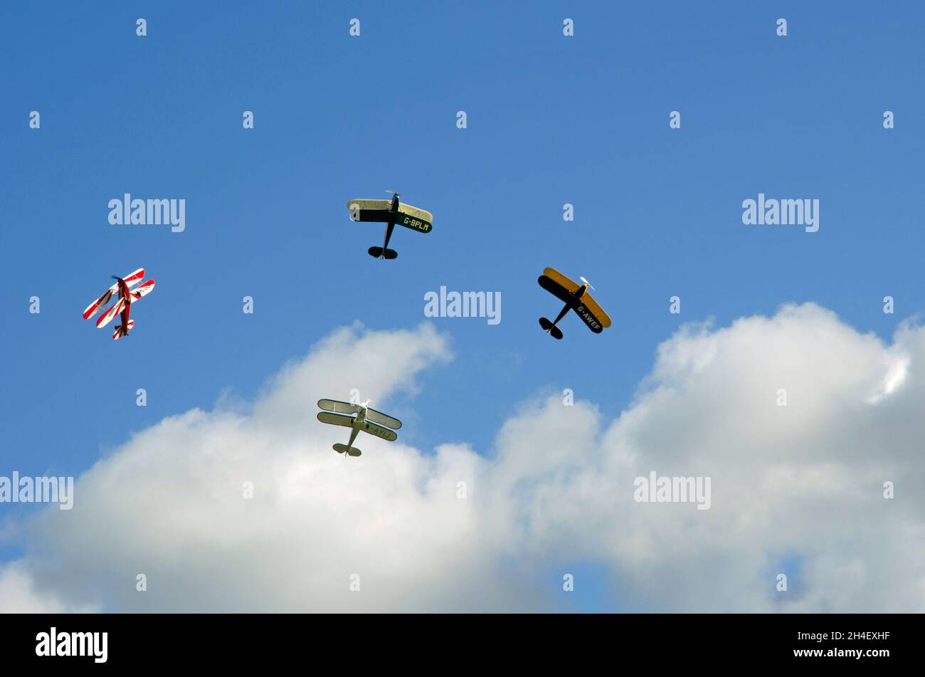 Four Vintage  SNCAN Stampe - Vertongen SV-4 Biplanes in flying display. Stock Photo
