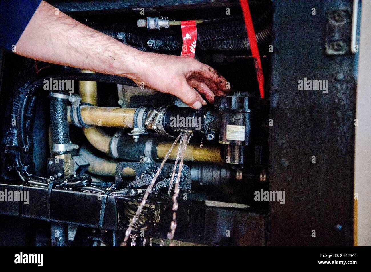 Augsburg, Germany. 08th Oct, 2021. A man works on the radiator of a bus operated with natural gas/compressed natural gas (CNG) for the Augsburg municipal utility. Credit: Finn Winkler/dpa/Alamy Live News Stock Photo