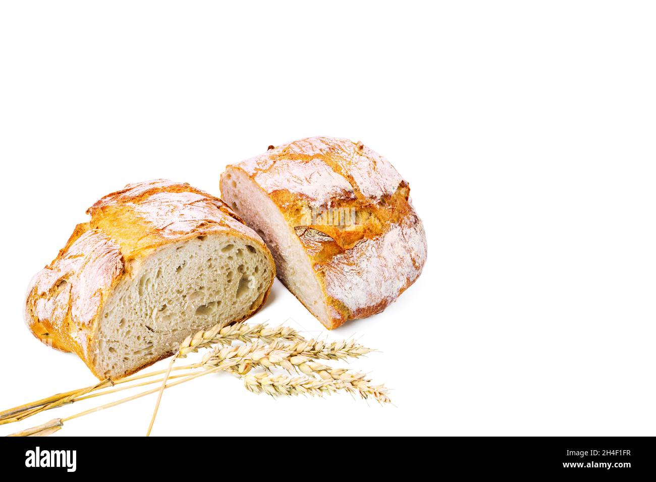 View of cut loaf white bread and wheat ears isolated on white ...
