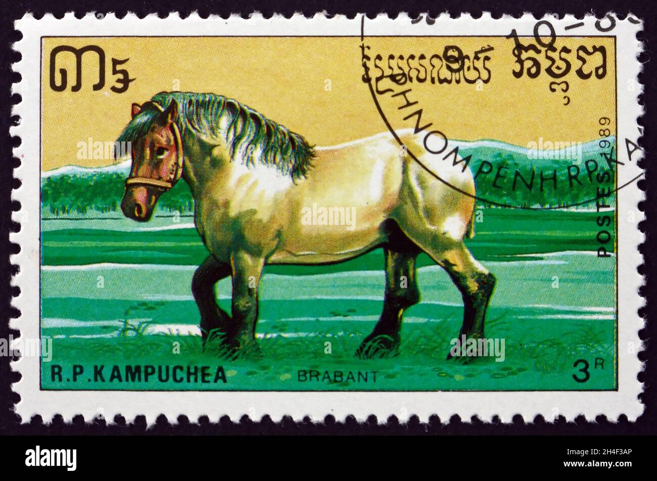 CAMBODIA - CIRCA 1989: a stamp printed in Cambodia shows Brabant, Belgian draft horse, is a draft horse breed from Belgium, circa 1989 Stock Photo