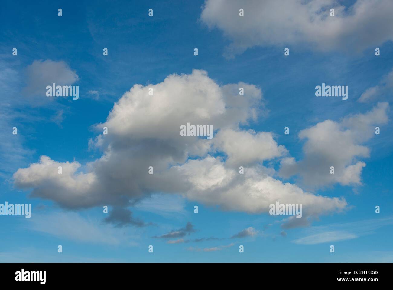 Small group of clouds in a blue sky Stock Photo