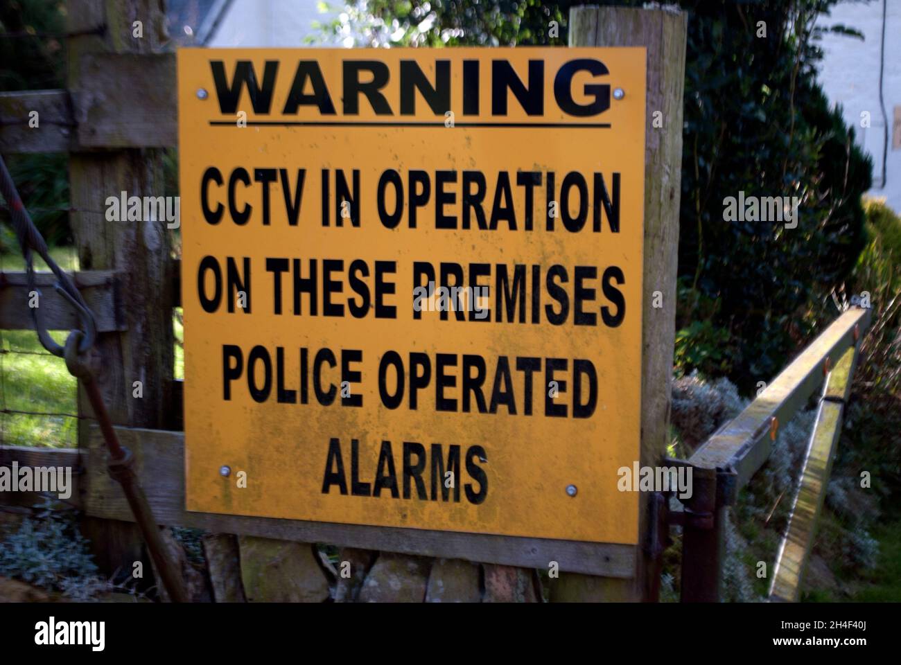 Warning CCTV in operation on this premises police operated alarms sign