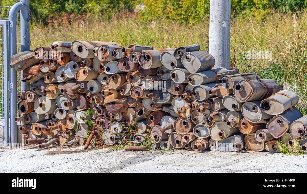 Collection of Damaged Rusty Exhaust Muffler Catalytic Converters Stock