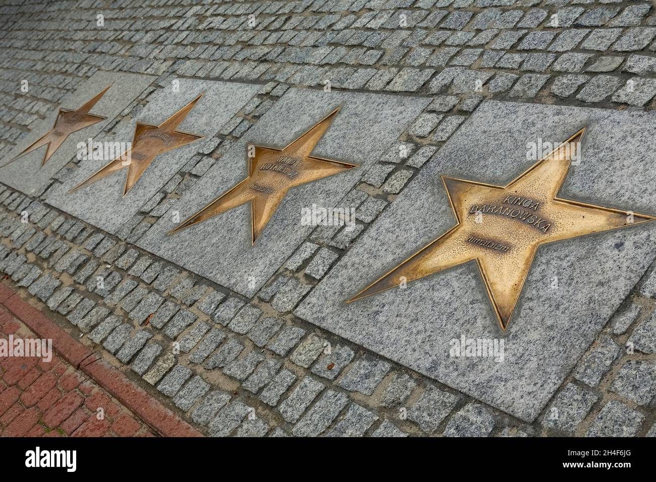 Wladyslawowo, Poland - September 12, 2014: The Stars made of bronze with the names of sportsmen on the Avenue of the Stars of Sport, created in 2000 Stock Photo
