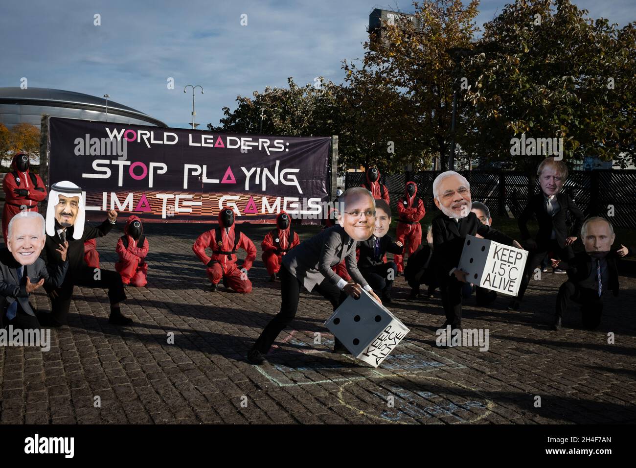 Glasgow, UK. Extinction Rebellion ‘Squid Game’ themed protest, telling world leaders not to play games at the 26th UN Climate Change Conference, known as COP26, in Glasgow, Scotland, on 2 November 2021. Photo: Jeremy Sutton-Hibbert/Alamy Live News, Stock Photo