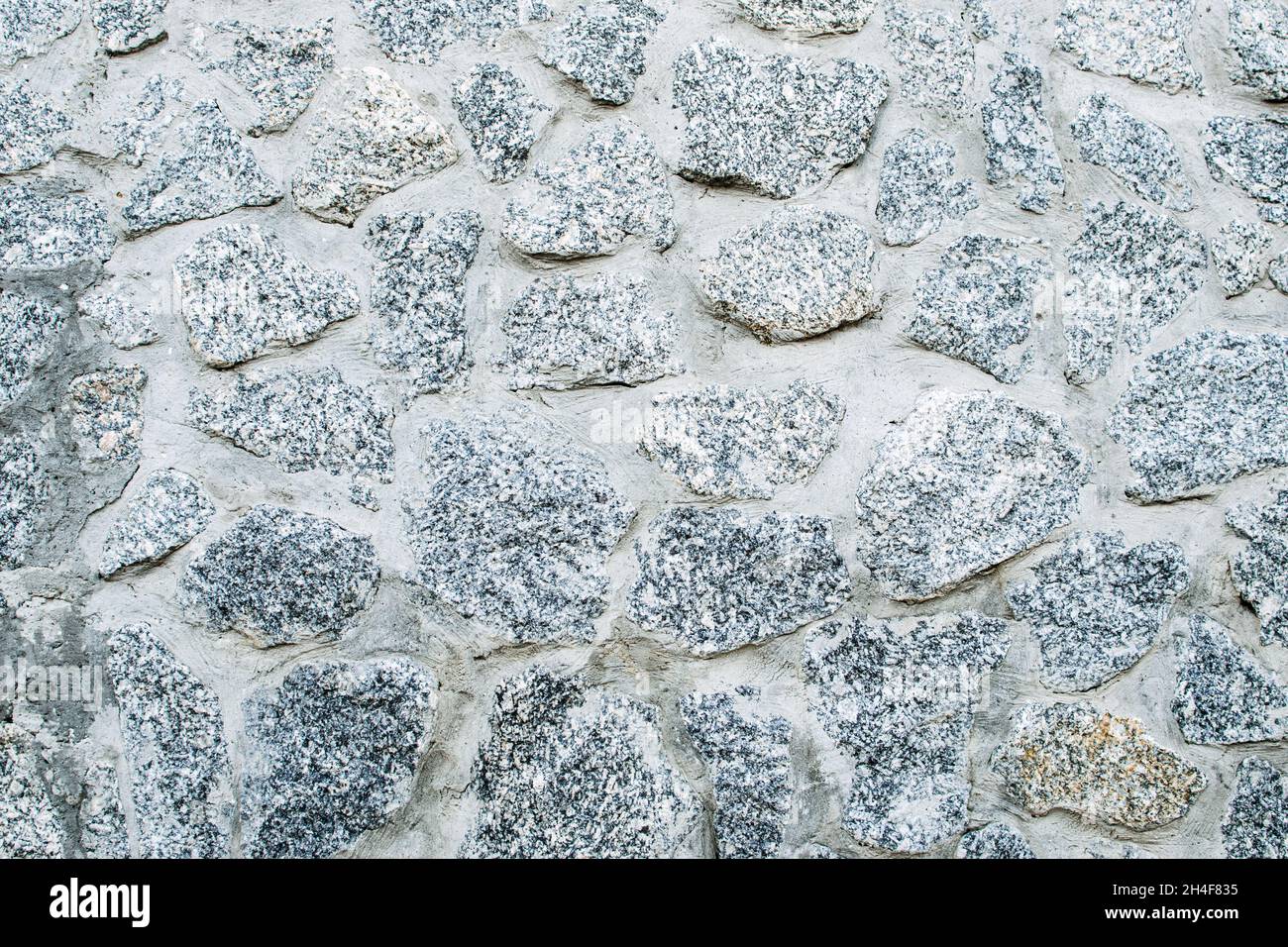 Stone wall texture background. Gray stone wall background. Stock Photo