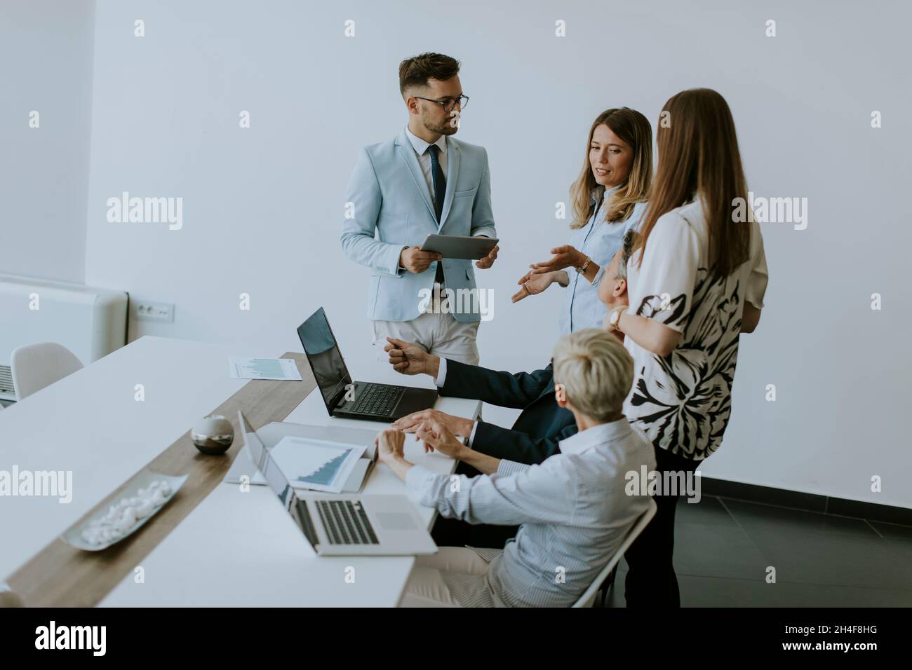 View at group of business people working together and preparing new project on a meeting in the office Stock Photo
