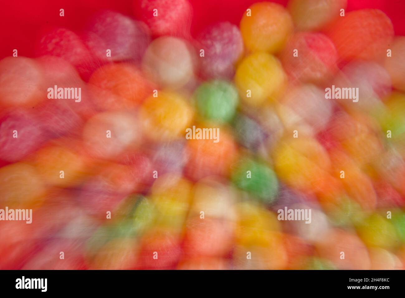Colorful fusion of shape, texture, form and design of rounded shaped candies, purposely out focus. Attention grabber, pulls the viewer in Stock Photo