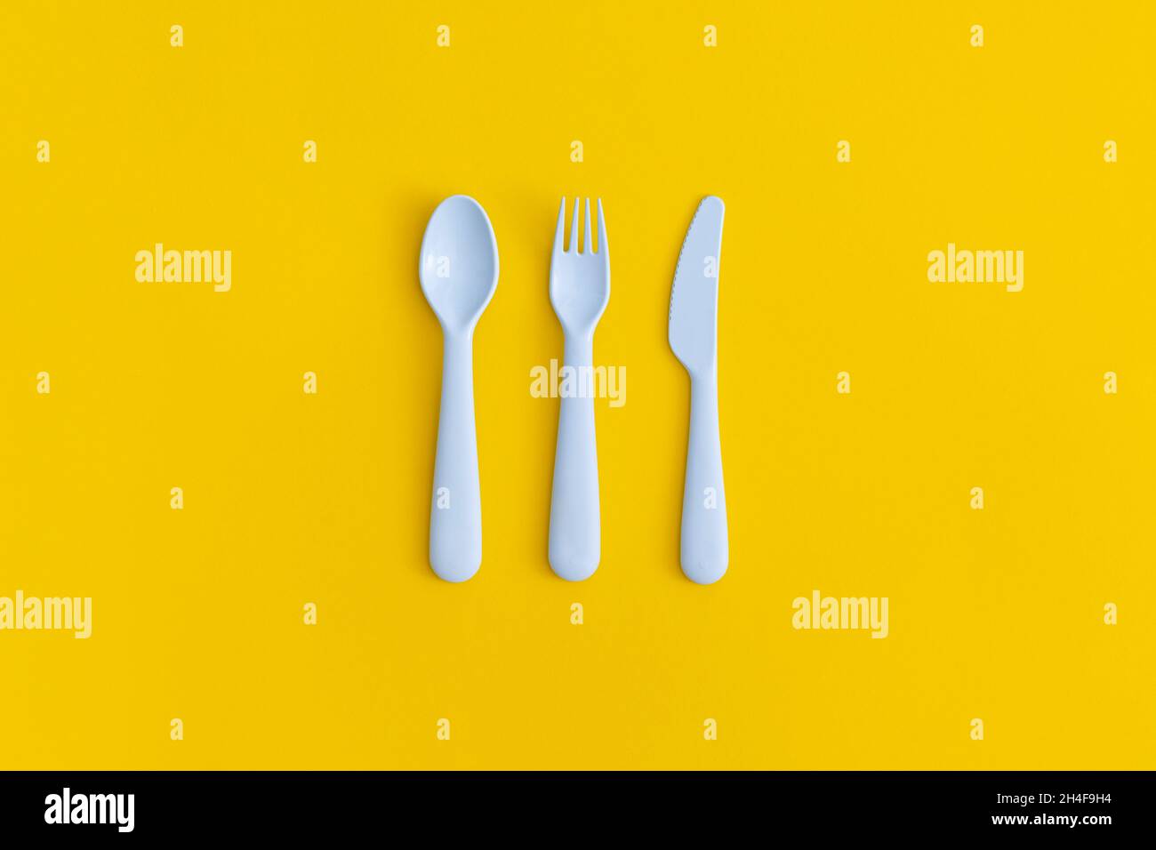 https://c8.alamy.com/comp/2H4F9H4/food-plastic-packaging-on-yellow-background-concept-of-recycling-plastic-and-ecology-2H4F9H4.jpg