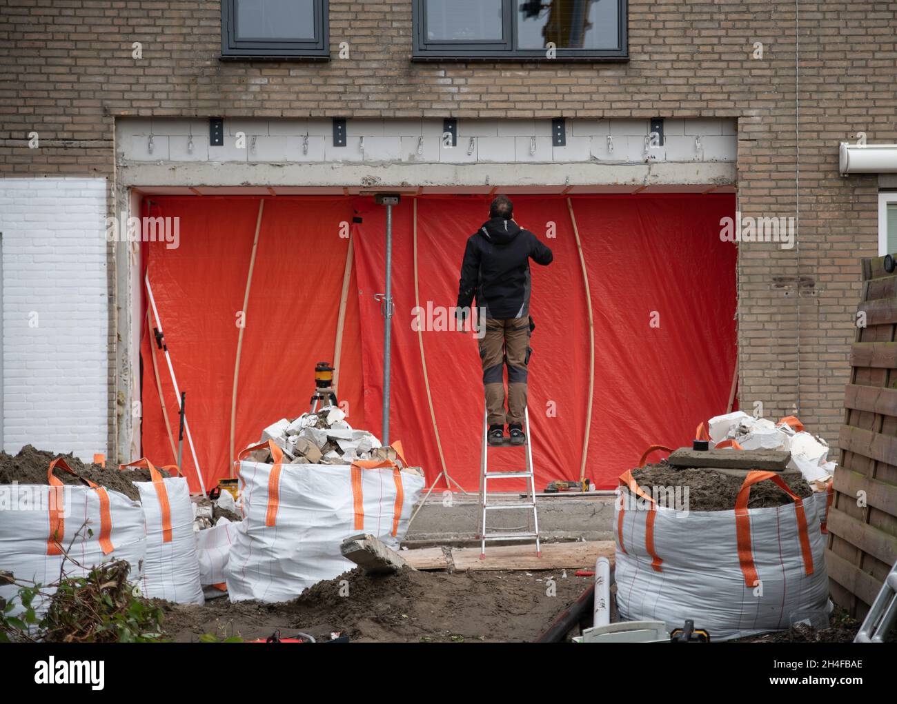 a facade removed from a house for reconstruction Stock Photo