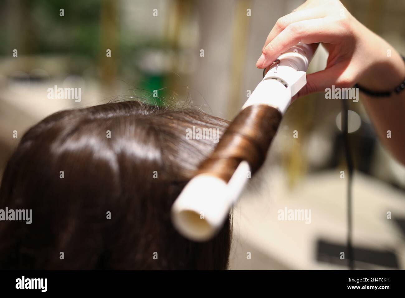 Pretty brunette client with long hair Stock Photo
