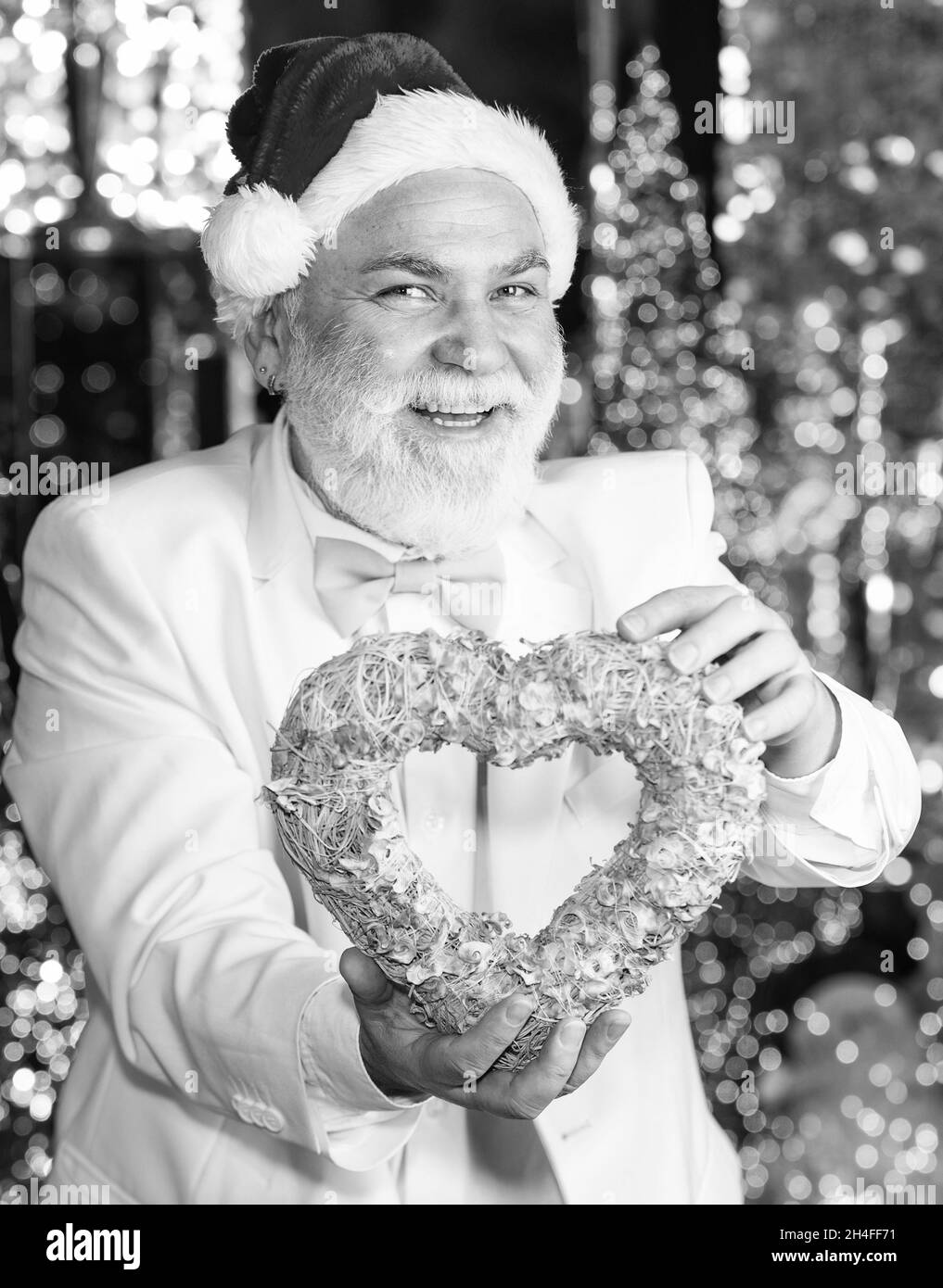 Charity and kindness. Santa Claus. Mature man with white beard. Christmas eve. Lovely greetings. Senior man celebrate christmas. Kind grandpa with Stock Photo