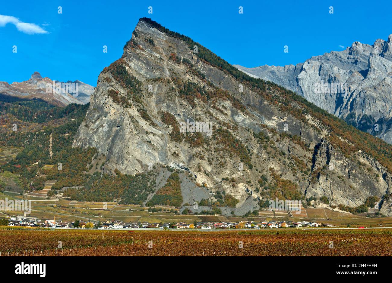 The municipality of Leytron at the foot of the Ardeve mountain peak, Leytron, Valais, Switzerland Stock Photo