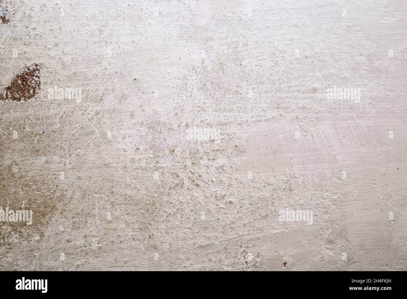 Texture of the whitewashed wall with scuffs, scratches and dirty spots Stock Photo