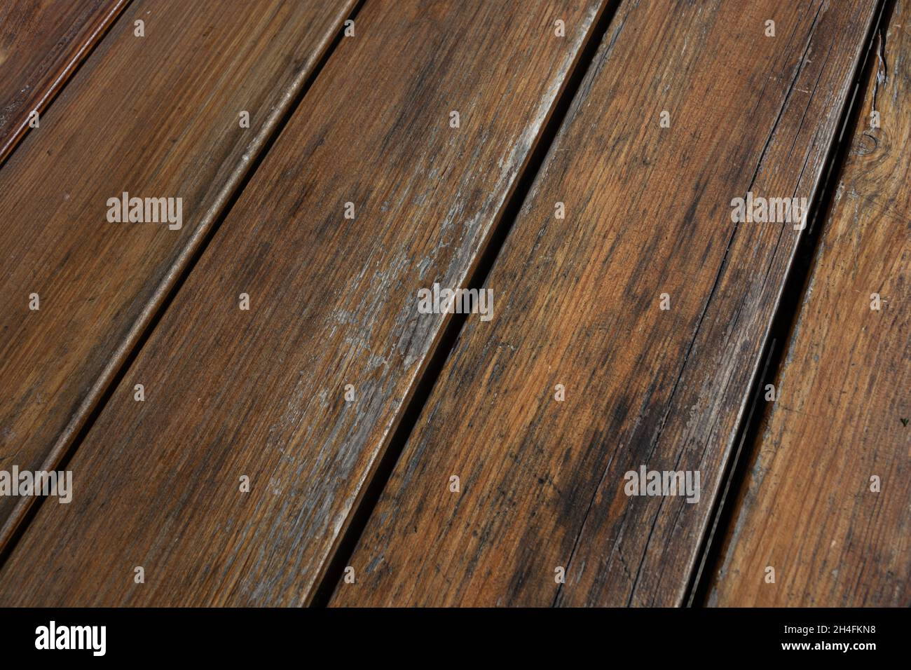 Shabby planks background. Peeled varnish on wood. Selective focus Stock Photo