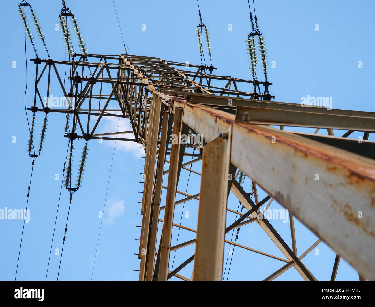 Bottom view over the electric power high voltage transmission line tower in Kyiv, Ukraine. Electric power industry concept. Stock Photo
