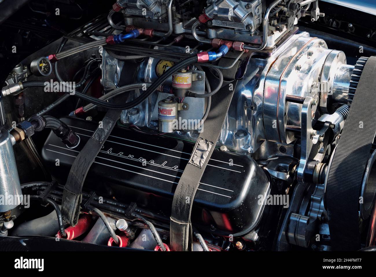 A high performance Chevrolet engine with turbocharger and hold-down straps at the 2021 Endless Summer Cruisin in Ocean City Maryland. Stock Photo