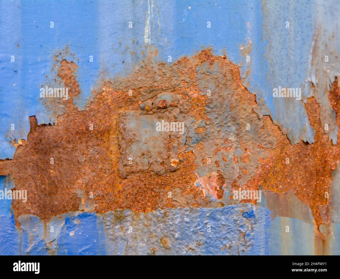 Rusted surface of blue metal shield Stock Photo
