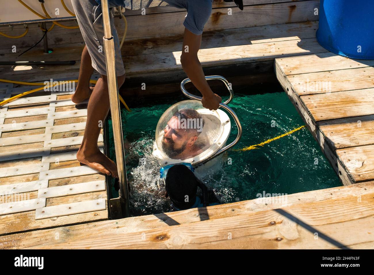 diving in an underwater helmet in the ocean on the island of Mauritius