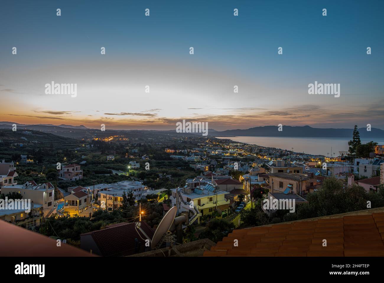 Night over Platanias bay from a high viewpoint, Crete, Greece, October 10, 2021 Stock Photo