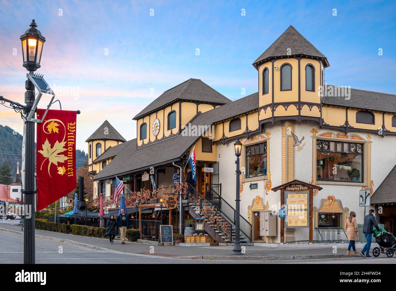 Tourists enjoy an early evening on the main street of the Bavarian Themed village of Leavenworth in the Cascade mountains of Washington. Stock Photo
