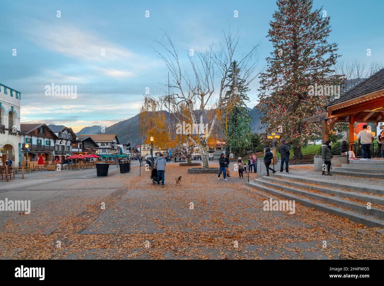 Tourists enjoy an early evening on the main street of the Bavarian Themed village of Leavenworth in the Cascade mountains of Washington. Stock Photo