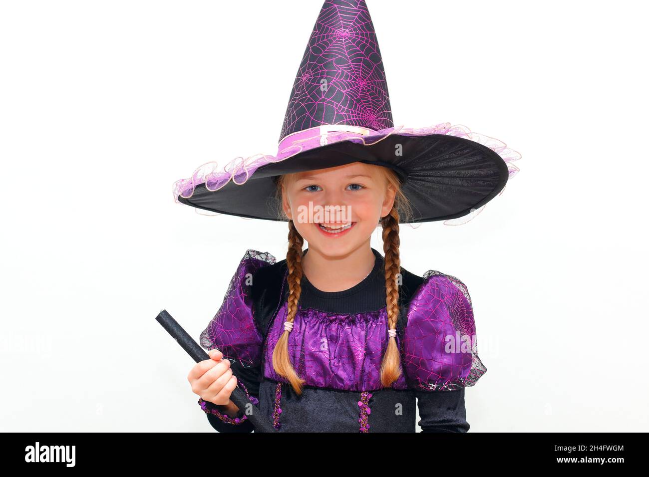 A 6 year old girl in a Witches halloween costume Stock Photo