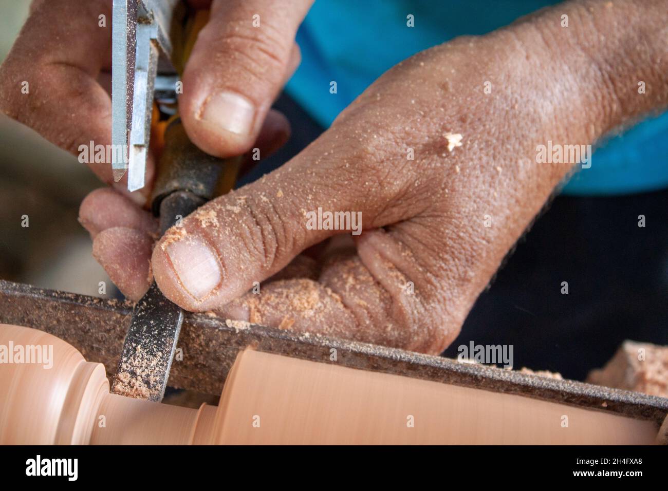 Senior hands turning wood Stock Photo