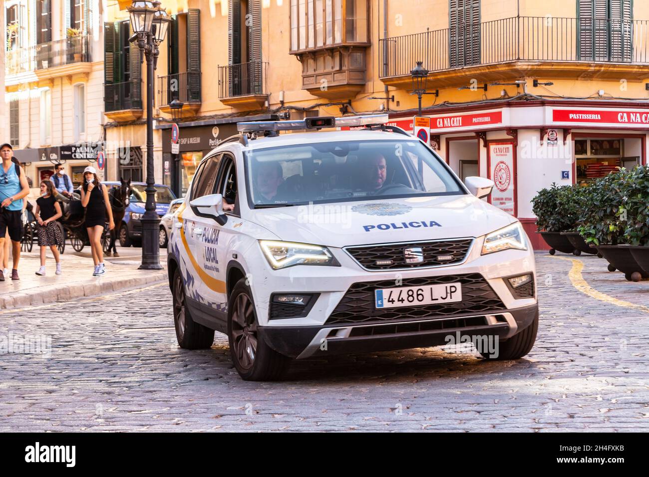 Spanish Seat police car driving in street in Palma Mallorca Stock Photo
