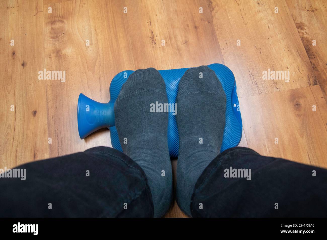Cold feet in the home office Stock Photo