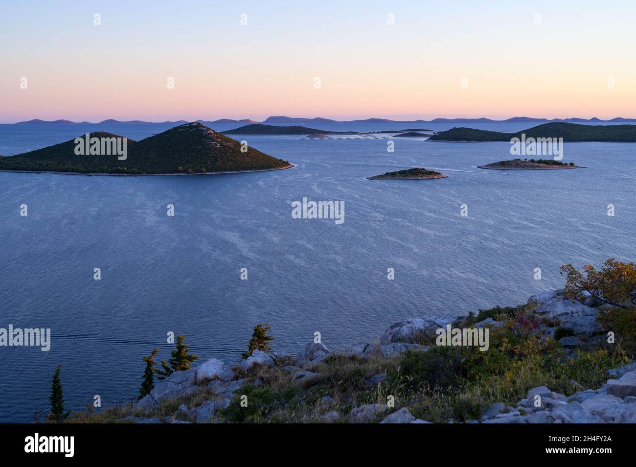 Small islands near Drage (Dalmatia, Croatia) sunset in late summer, adriatic sea Stock Photo