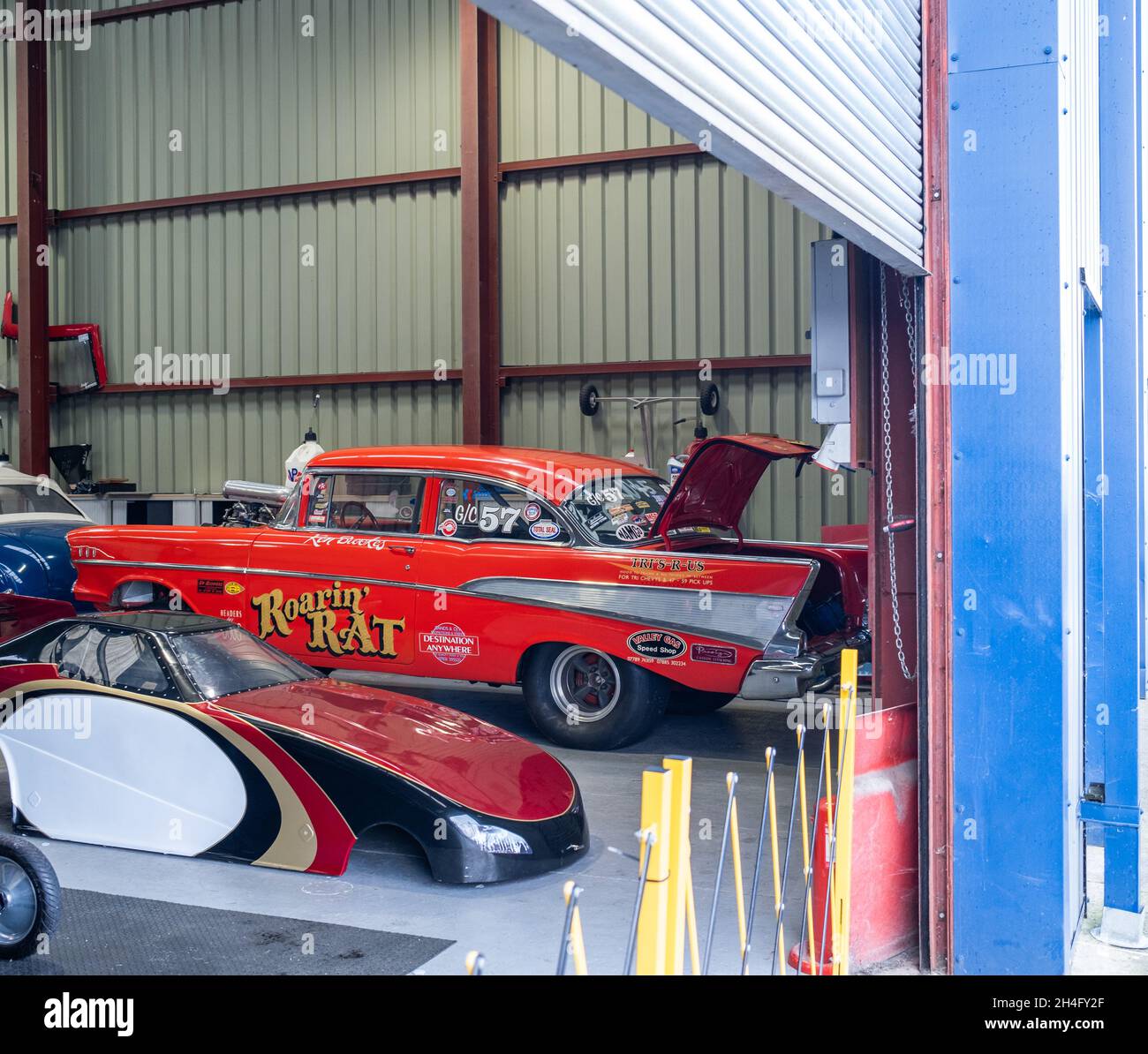 Roarin’ Rat drag racing car in the garage for working on before running the drag strip at Santa Pod Raceway, October 2021 Stock Photo