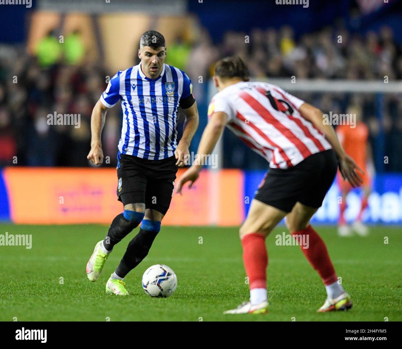 Sheffield, UK. 02nd Nov, 2021. Callum Paterson #13 of Sheffield Wednesday looks for a way past Callum Doyle #6 of Sunderland in Sheffield, United Kingdom on 11/2/2021. (Photo by Simon Whitehead/News Images/Sipa USA) Credit: Sipa USA/Alamy Live News Stock Photo