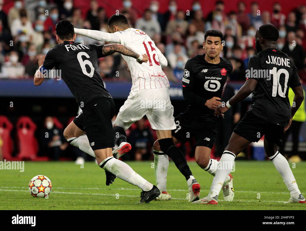 2nd November 2021; Ramon Sanchez-Pizjuan Stadium, Sevilla, Adalusia, Spain, ECL Champions League football, Sevilla versus Lille; Youssef En-Nesyri of Sevilla and José Fonte of LOSC Lille Métropole challenge for the loose ball Stock Photo