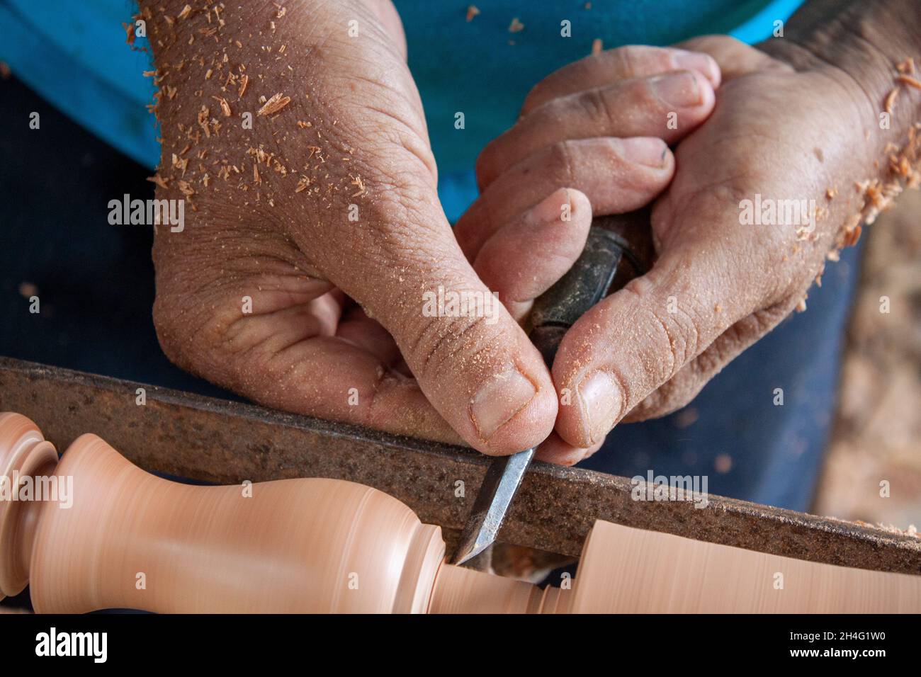 Senior hands turning wood Stock Photo