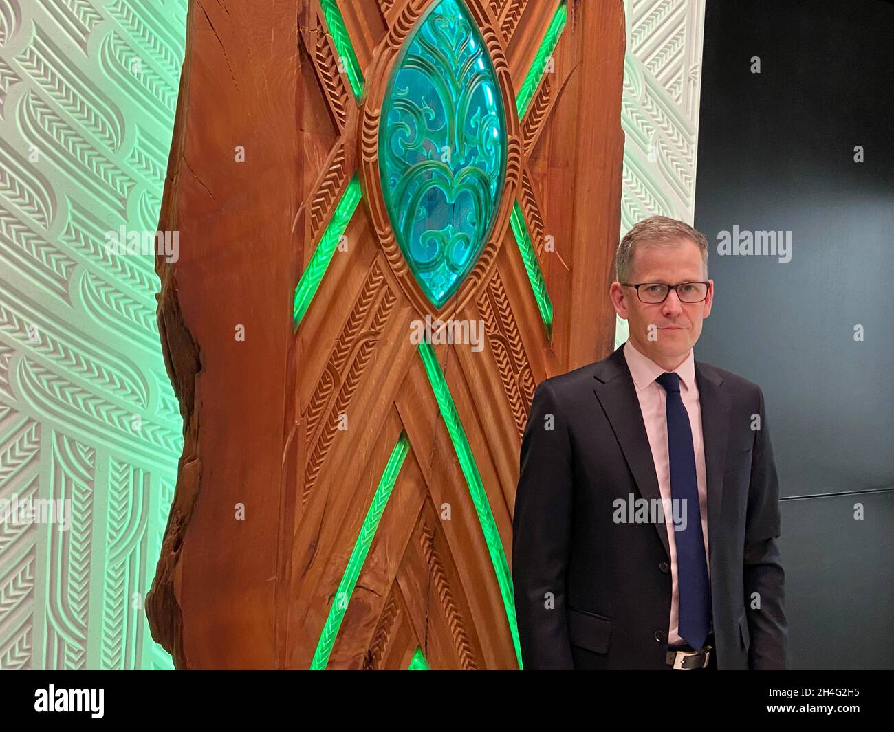 Assistant Governor Christian Hawkesby stands with an art installation of Maori forest god Tane Mahuta at the lobby of New Zealand's Central Bank building in Wellington, New Zealand September 22, 2021. Picture taken September 22, 2021. REUTERS/Praveen Menon Stock Photo