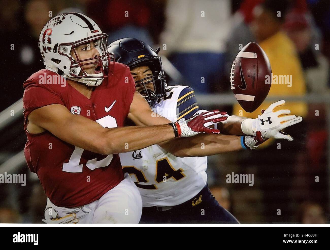 Handoff by Stanford quarterback during the Cal game Stock Photo