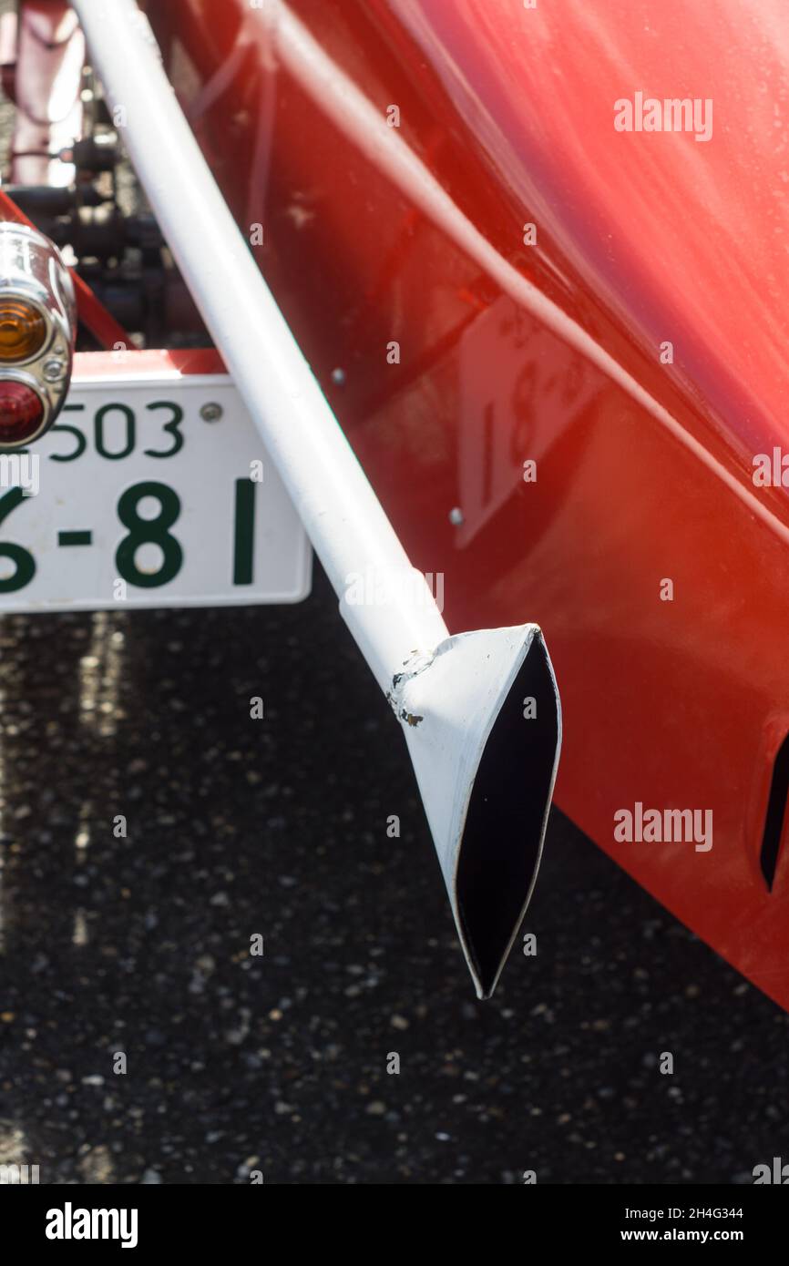 Close up detail of the white exhaust pipe on a 1927 red Amilcar C6 Voiturette classic vintage sports racing car Stock Photo