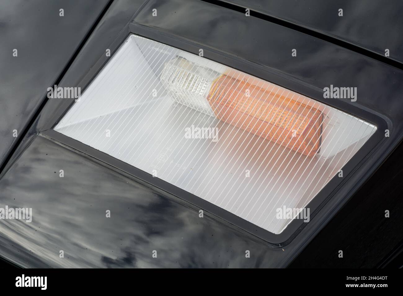 Close up detail of the front sidelight and indicator turn signal on a