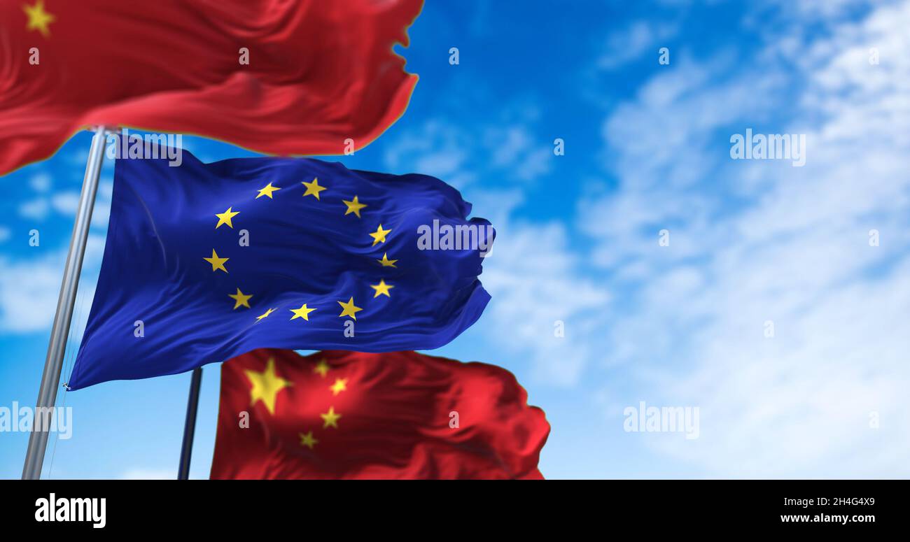 The flag of the European Union waving between two national flags of China. International