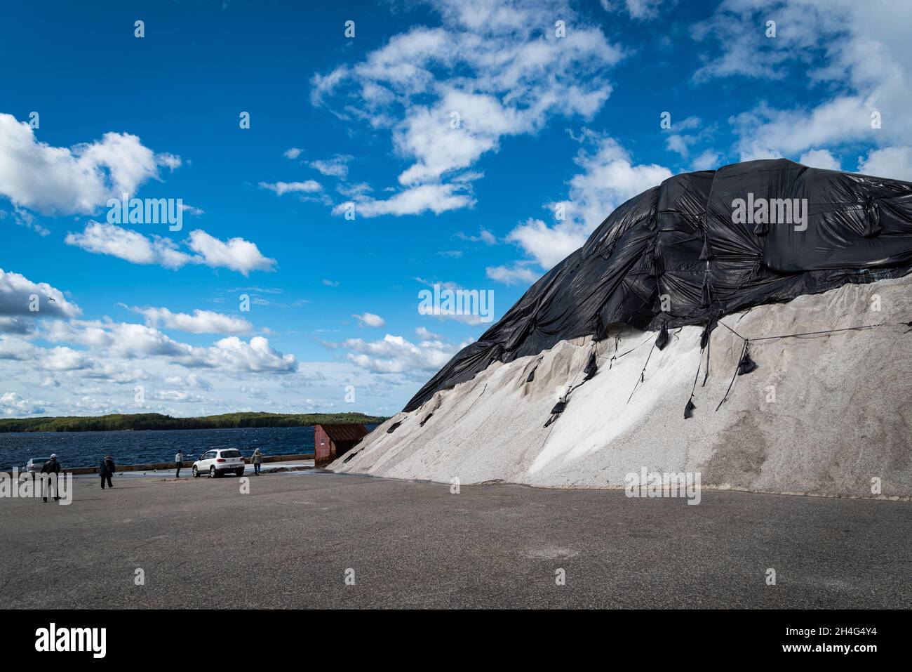 The salt pile on the Smelter Wharf, commonly called the Salt Docks by locals.  It is a salt stopover located on the Georgian Bay on Lake Huron. Stock Photo