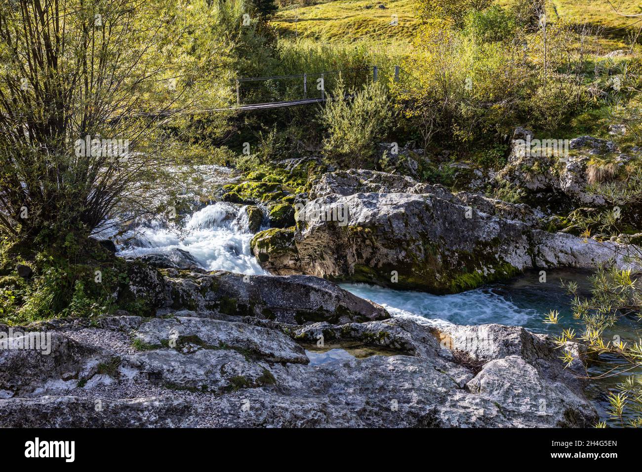 Suspension bridge over the river Lepenjica flowing through a valley of the Julian Alps in Triglav National Park, Slovenia, 11.10.2021. Stock Photo