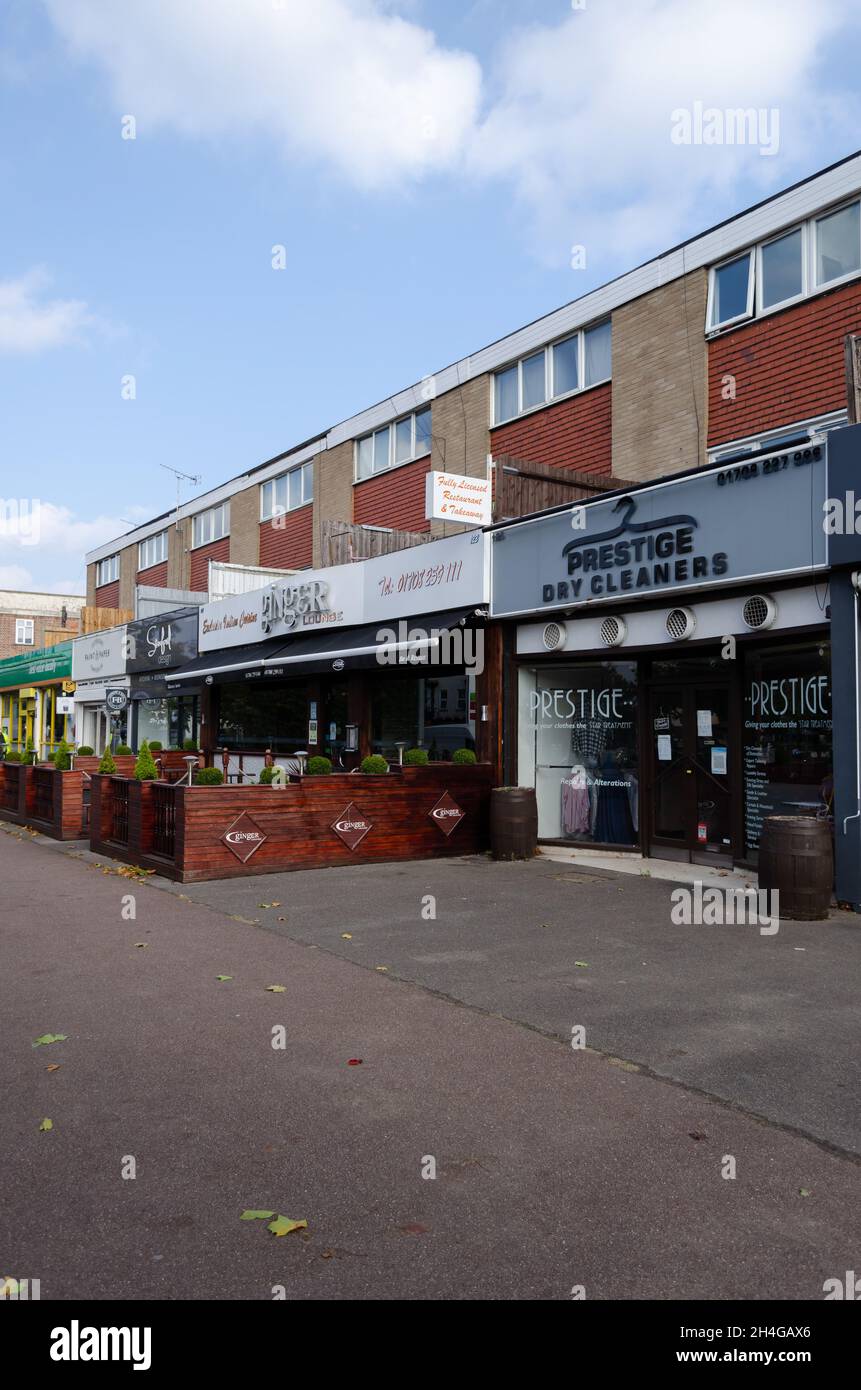 High street shops with apartments above, along Corbets Tey Road in