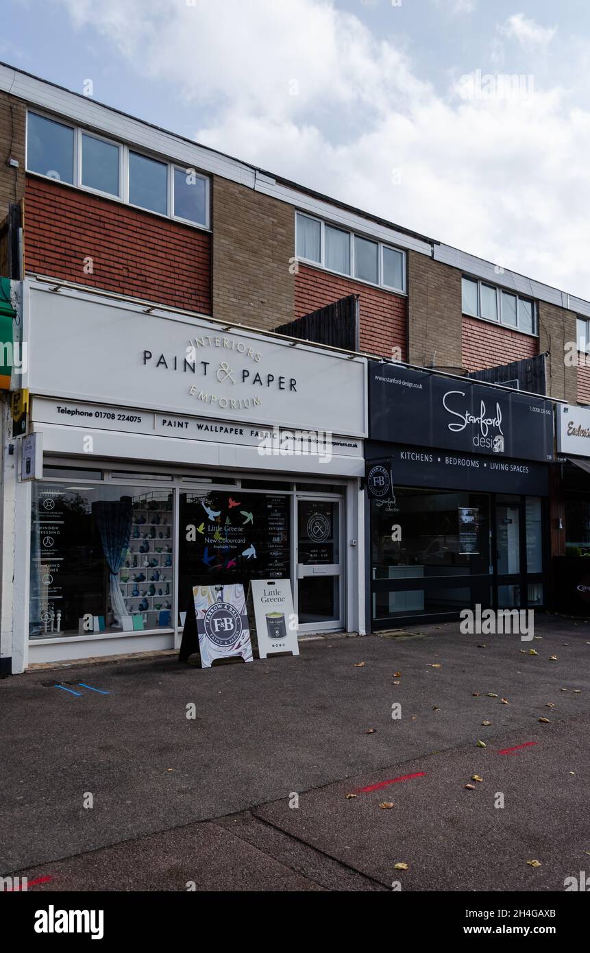 High street shops with apartments above, along Corbets Tey Road in