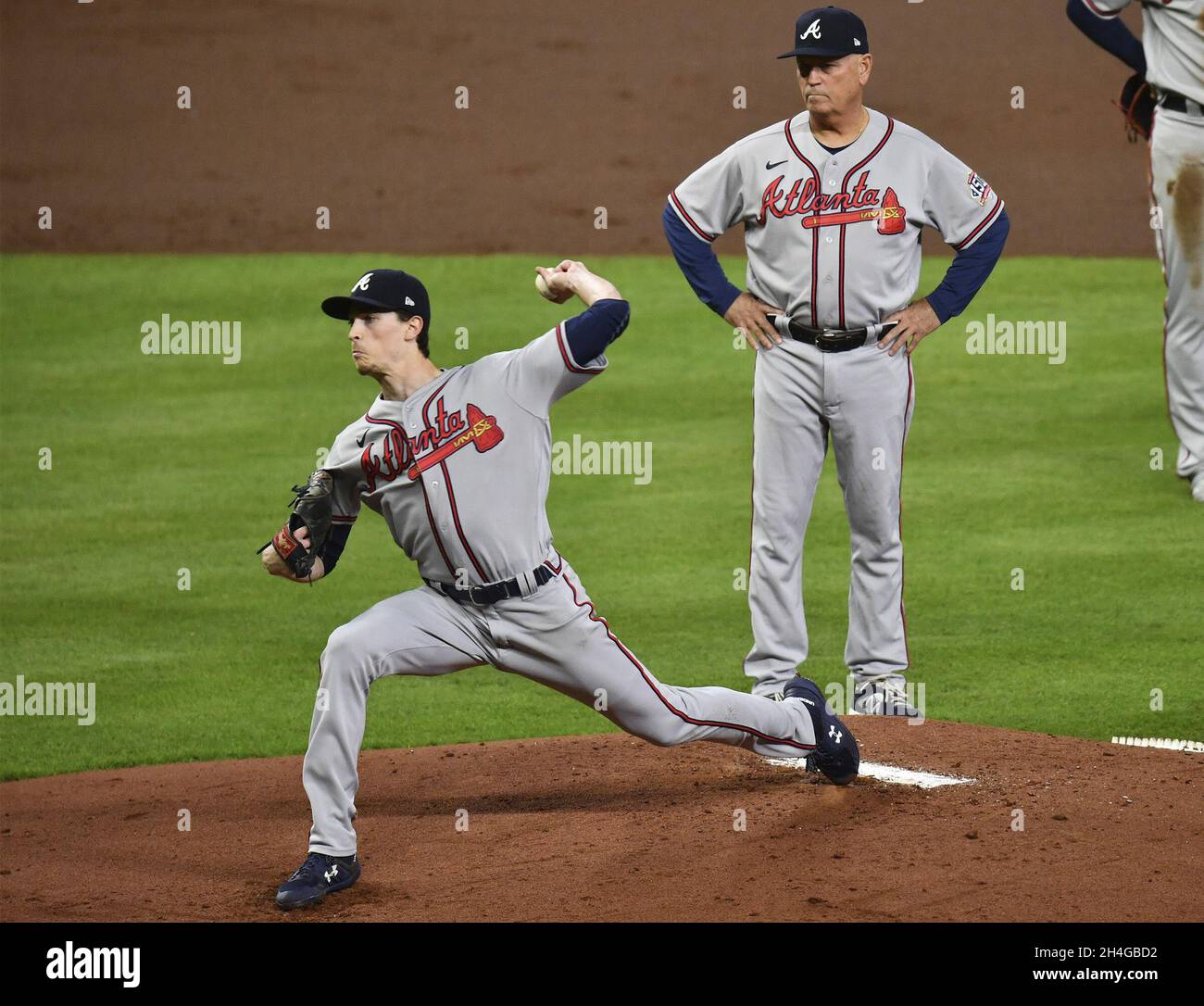 Houston, United States. 02nd Nov, 2021. Atlanta Braves starter Max Fried tries to throw under the watchful eye of manager Brian Snitker after having his ankle stepped on by Houston Astros Michael Brantley on a play at first during the first inning in game six in the MLB World Series at Minute Maid Park on Tuesday, November 2, 2021 in Houston, Texas. Houston returns home facing elimination trailing Atlanta 3-2 in the series. Photo by Maria Lysaker/UPI Credit: UPI/Alamy Live News Stock Photo