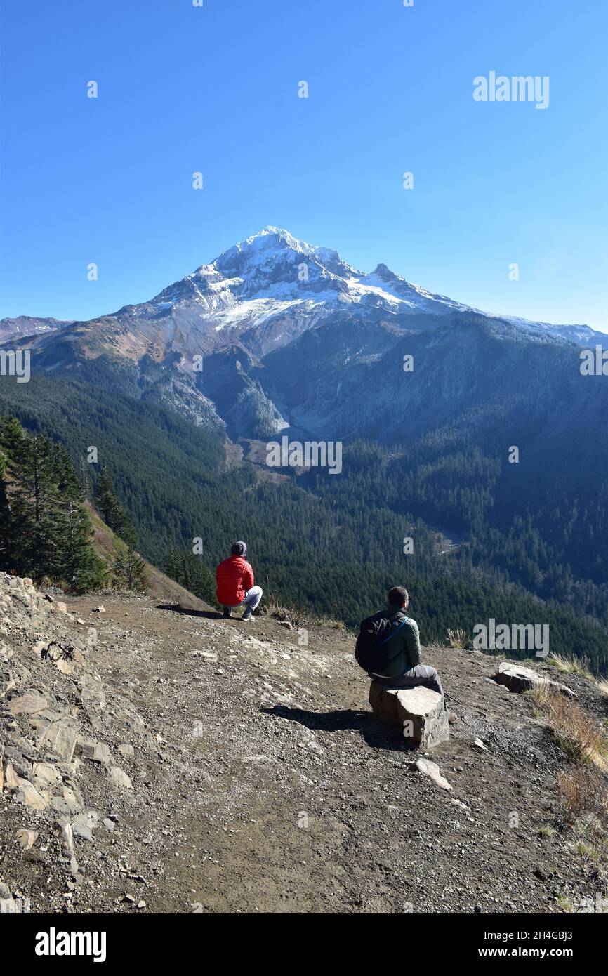Two hikers enjoy spectacular views of Mt Hood from Bald Mountain on an October day on the McNeil Point Trail in the Mt Hood Wilderness Oregon USA Stock Photo Alamy