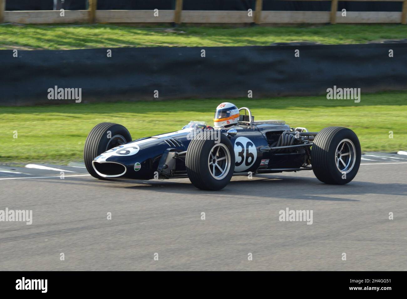 The F1 Gurney Weslake Eagle V12 doing demonstration laps at Goodwood Revival 2018 driven by Derek Bell (pictured) and Sir Jackie Stewart. Stock Photo
