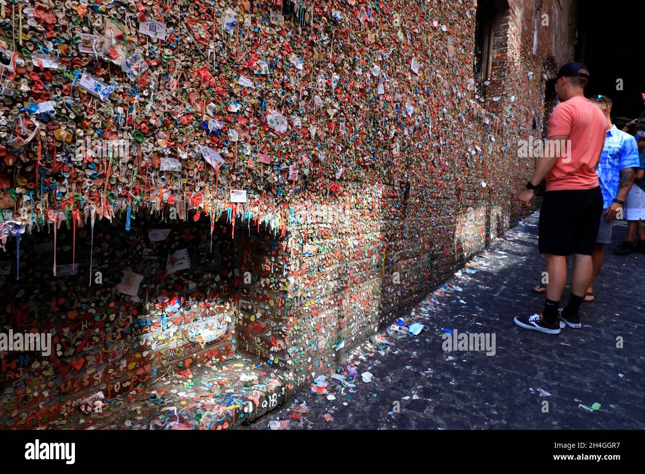 Tourists visiting the Gum Wall at Post Alley under Pike